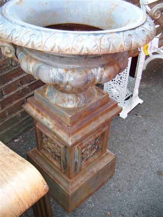 Cast iron urn on stand